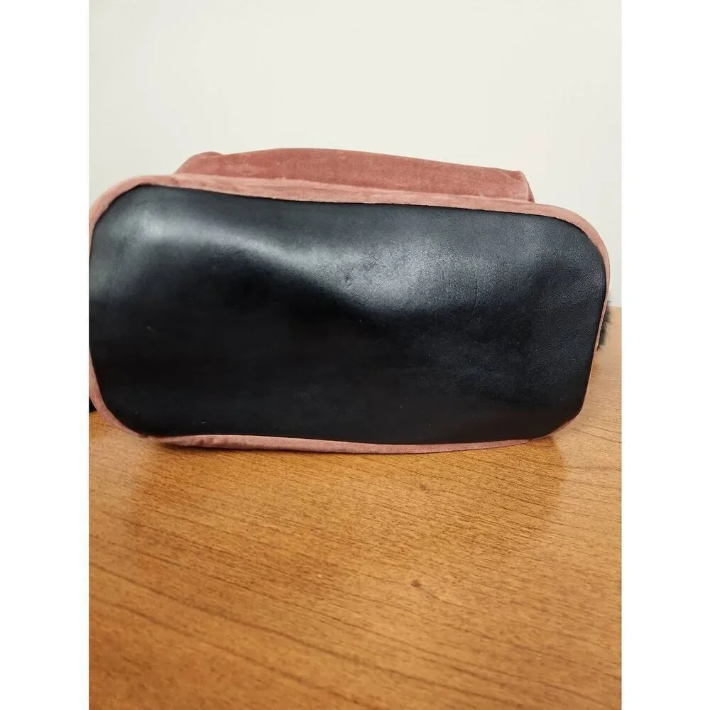 Guess small velvet feel pink backpack with black straps and pom. Measures approx